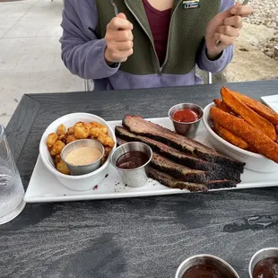 Brisket platter with cheese curds and sweet potato fries