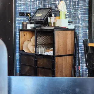 Notice the spray bottle sitting on the stack of plates.. gross!