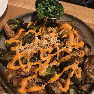 Fried Brussel sprouts - spicy aioli, sesame, cilantro (on the side for us since company with us does not like it) - delicious!!