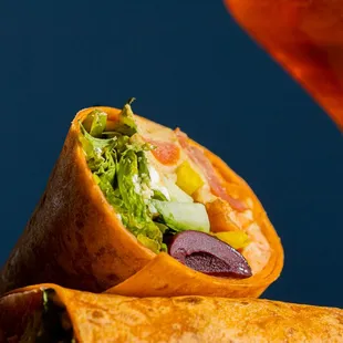 a burrito and a glass of wine