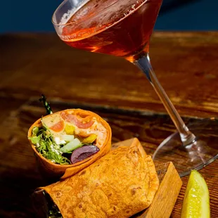 a glass of wine and a plate of food