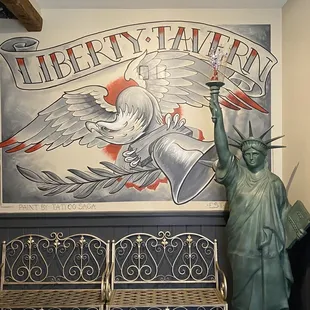 the statue of liberty holding a lit candle