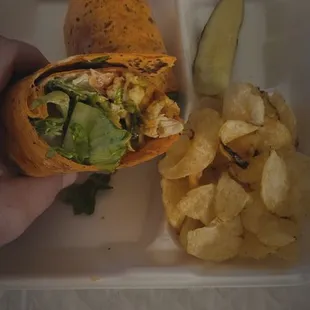 Buffalo Chicken Wrap with chips and a pickle