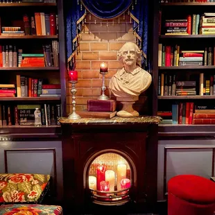 a bust of a man with candles