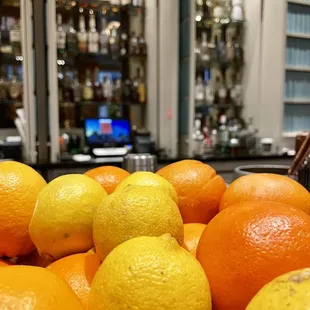 oranges and lemons on a counter
