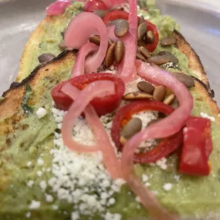 Avocado Toast $13 ( pickled onions and Fresno peppers)