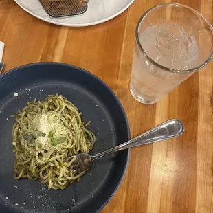 a plate of pasta and a glass of water