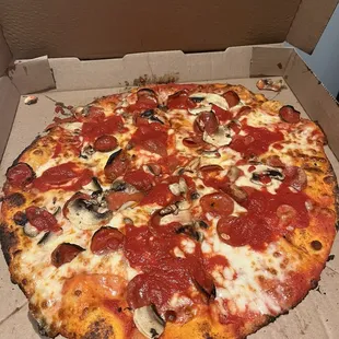 Stone fired Classico with pepperoni and mushrooms.