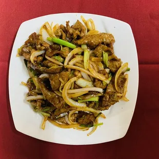 a plate of food on a red table cloth