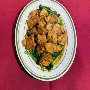 a plate of food on a red table cloth
