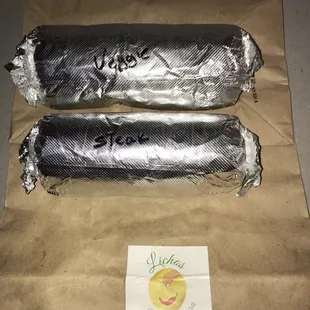 two wrapped burritos