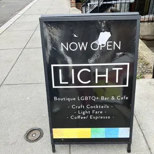 a sign on the sidewalk