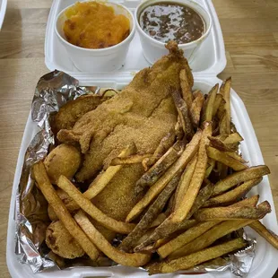 a tray of fried fish and fries