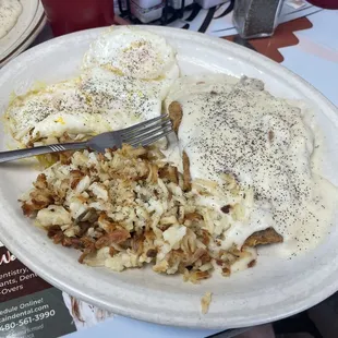 Country breakfast with biscuits and gravy and country fried steak