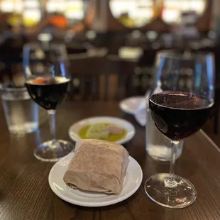 Bread, dipping oils, and wine.