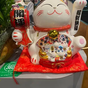 a cat statue on a table