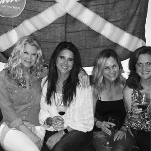 a group of women sitting on a couch