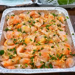 a tray of shrimp and vegetables