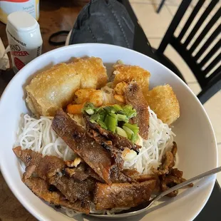 a bowl of beef and noodles