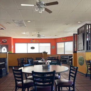 a dining room with a ceiling fan