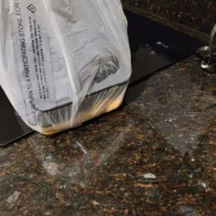 Bag loaded with sauce, rice and carne.
