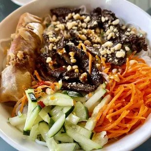 Grilled beef and eggroll noodle salad (lettuce and bean sprouts on the bottom)