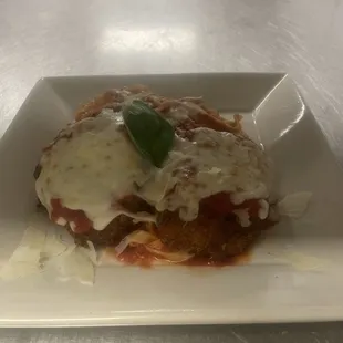 Chicken Parm: two never ever chicken breasts served over artisan made egg pasta and our house made red sauce.