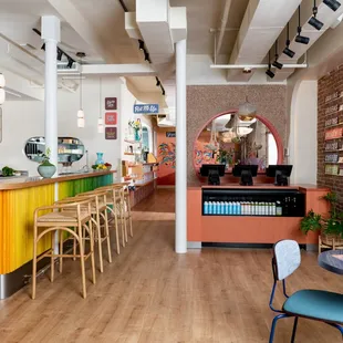 a colorful bar with stools