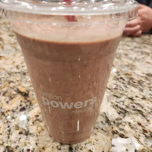 a smoothie in a plastic cup