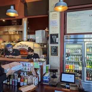 customers at the counter of a bakery