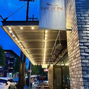 Outdoor seating with heaters.