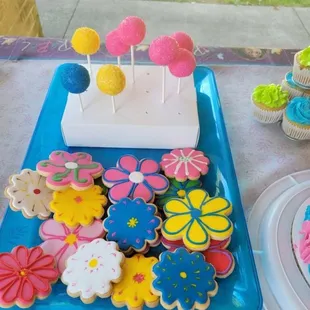 There's nothing like a display of happy cake pops and cookies for a party, or just to brighten someone's day!