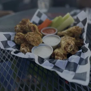 a basket of fried chicken wings