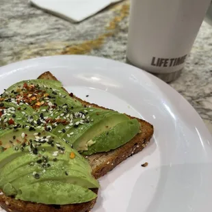 avocado toast on a white plate