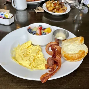 Outer Banks Breakfast - 2 eggs, biscuit, choice of sausage or bacon, grits or home fries. This one came with cup of fruit.