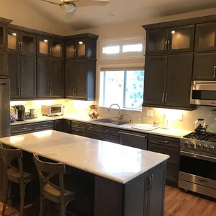 a kitchen with stainless steel appliances