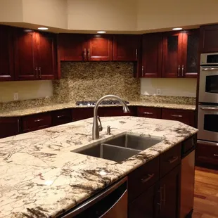 a kitchen with granite countertops