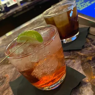 two cocktails on a table