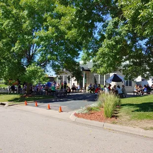 a group of people standing outside of a building