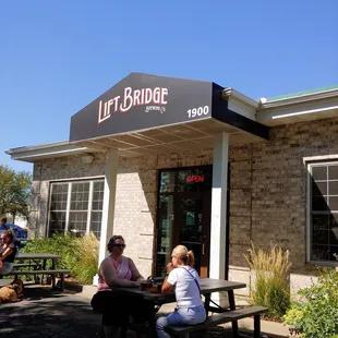 two people sitting at a picnic table