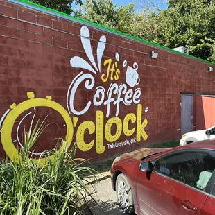 a red car parked in front of it