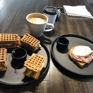 Waffle sandwich with ham, egg, and cheese  Avocado toast Latte Americano coffee
