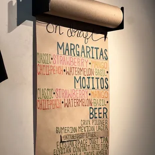 a menu hanging on a wall