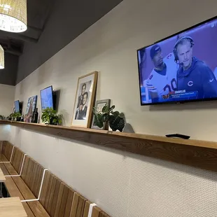 a television on a wall in a restaurant