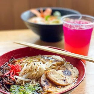 a bowl of ramen with chopsticks