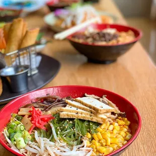 a bowl of ramen noodles with meat and vegetables