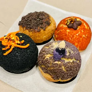 Amazing cream puffs! Thai tea w/ charcoal, Ube, Cookies &amp; Cream, and Pumpkin