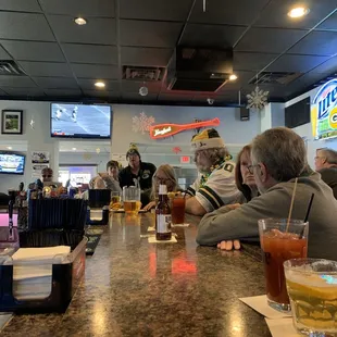 people sitting at the bar