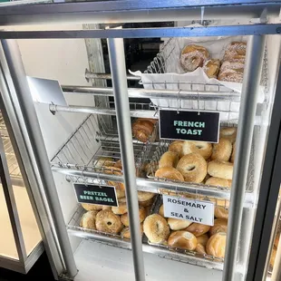 Bagel display case - temptingly yummy. Loads of flavors. Love the ROSEMARY + SEA SALT. So good - try it!