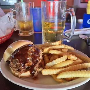 a hamburger and fries on a plate